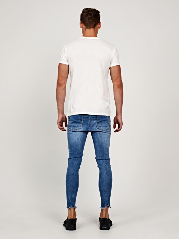 Damaged carrot cropped fit jeans with frayed hem