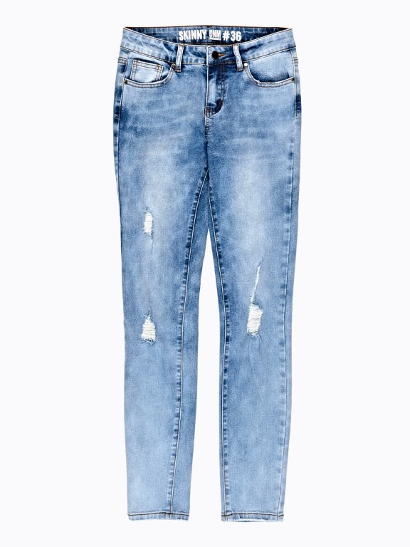 Damaged skinny jeans in snow wash