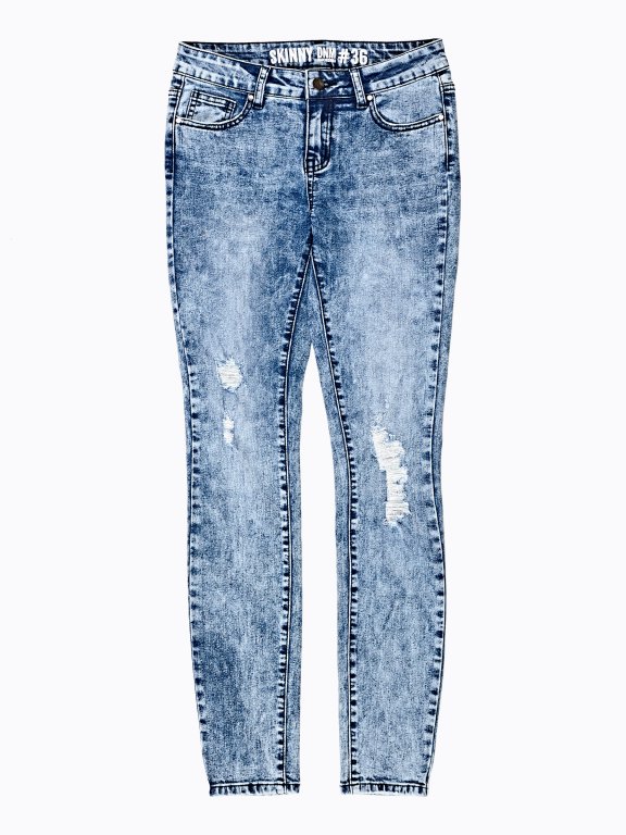 Damaged skinny jeans in snow wash