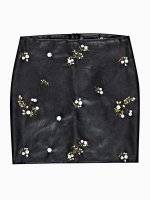Faux leather mini skirt with floral embroidery