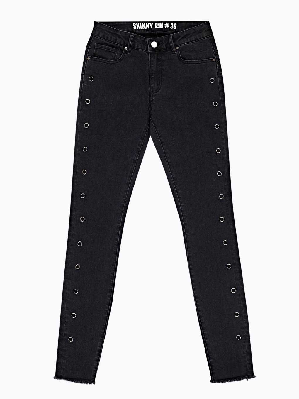 Skinny jeans with metal eyelets