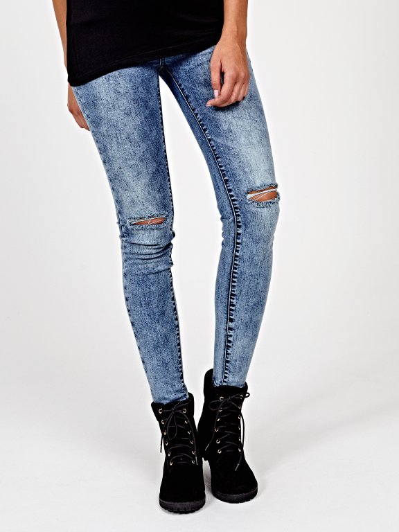 Ripped knees skinny jeans in blue wash