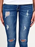 Ripped knees skinny jeans in mid blue wash