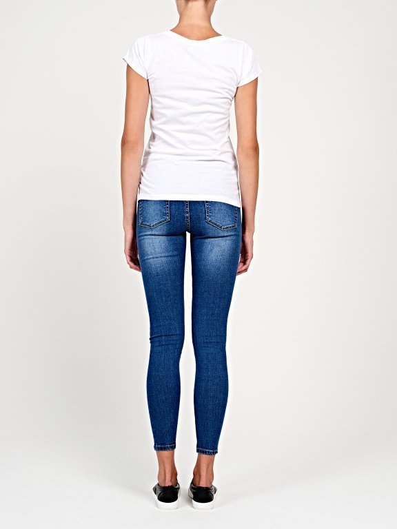 Ripped knees skinny jeans in mid blue wash