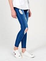 Distressed skinny jeans in mid blue wash