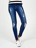 Damaged skinny jeans in mid blue wash