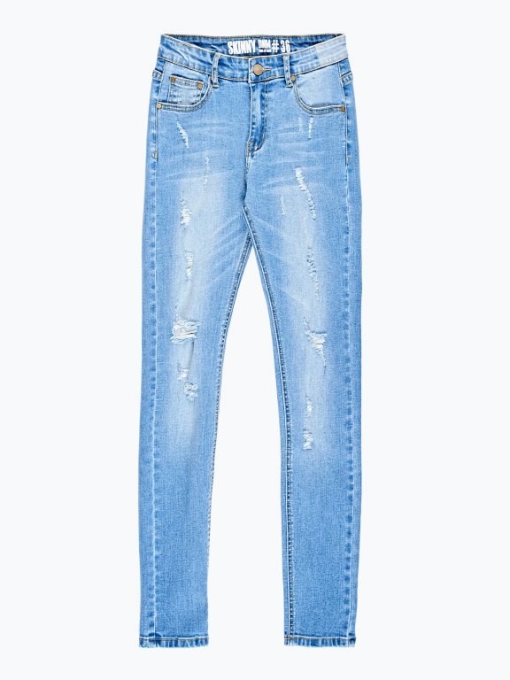 Damaged skinny jeans in mid blue wash