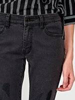 Damaged skinny jeans in black wash