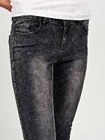 Skinny jeans with ankle zippers in black snow wash