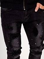 Damaged slim fit jeans with print