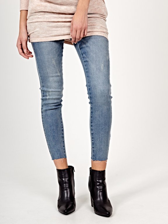 Distressed skinny cropped jeans in light blue wash