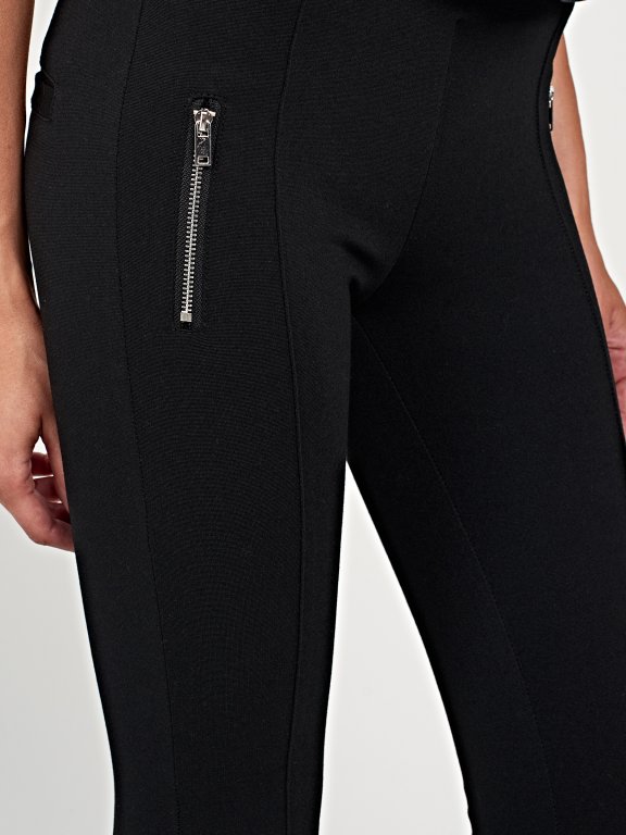 Knit trousers with zippers