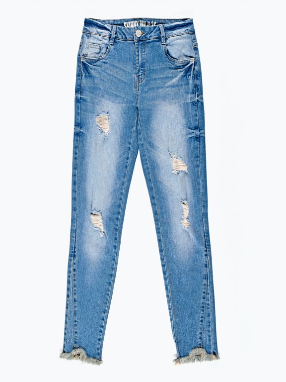 Ripped skinny jeans in mid blue wash
