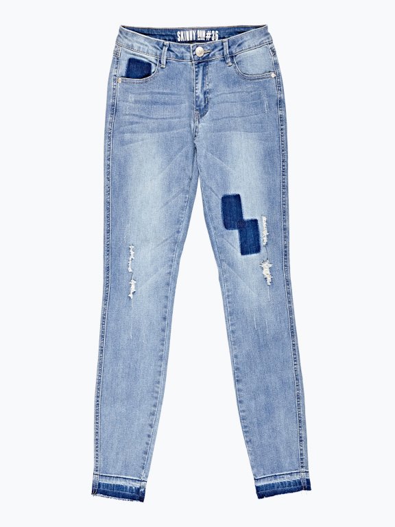 Distressed skinny jeans in blue wash