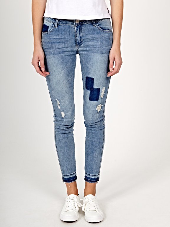 Distressed skinny jeans in blue wash