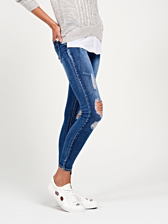Ripped skinny jeans in mid blue wash
