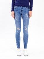 Taped skinny distressed jeans in mid blue wash
