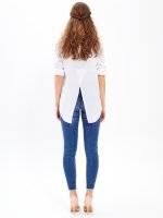 Taped skinny jeans in mid blue wash