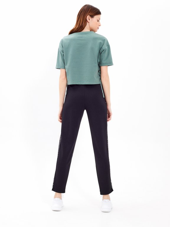 Trousers with lace panel