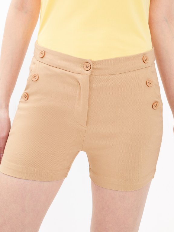Shorts with decorative buttons