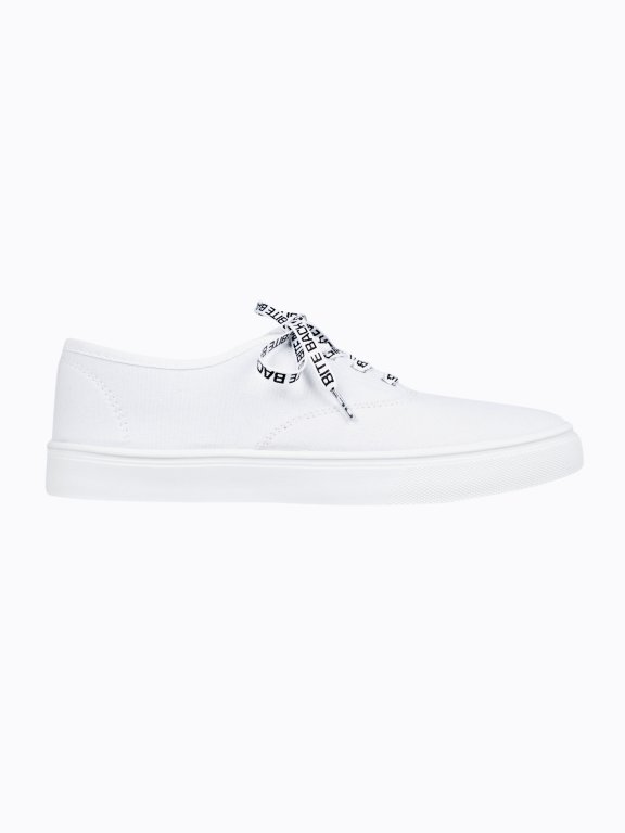 Plimsolls with printed shoelaces