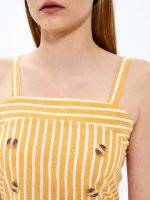 Striped crop top with tortoise shell buttons