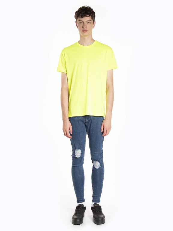 Damaged slim fit cropped jeans with zippers