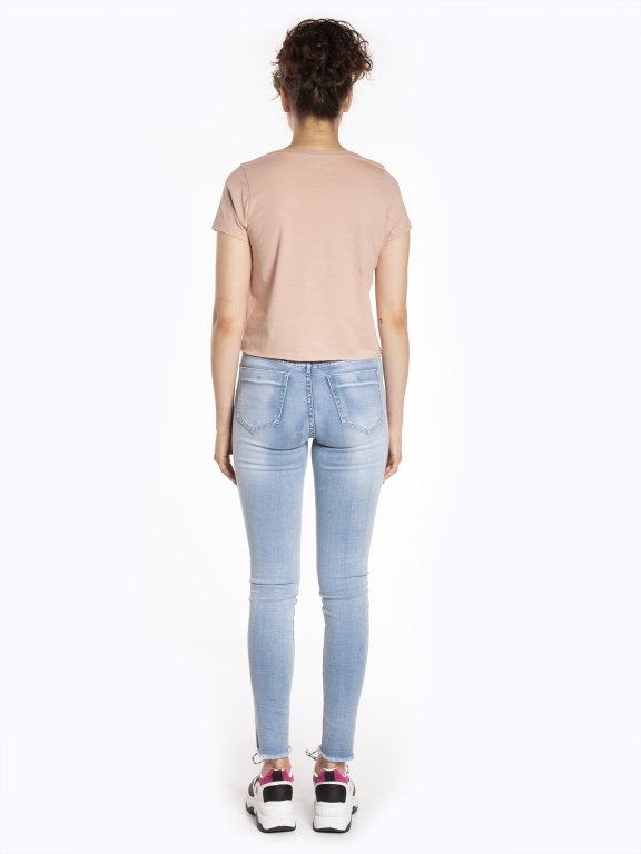 Skinny jeans with metallic side print