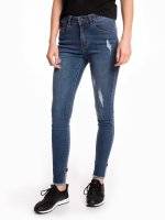 Taped distressed skinny jeans