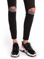 Leggings with decorative tape on knees