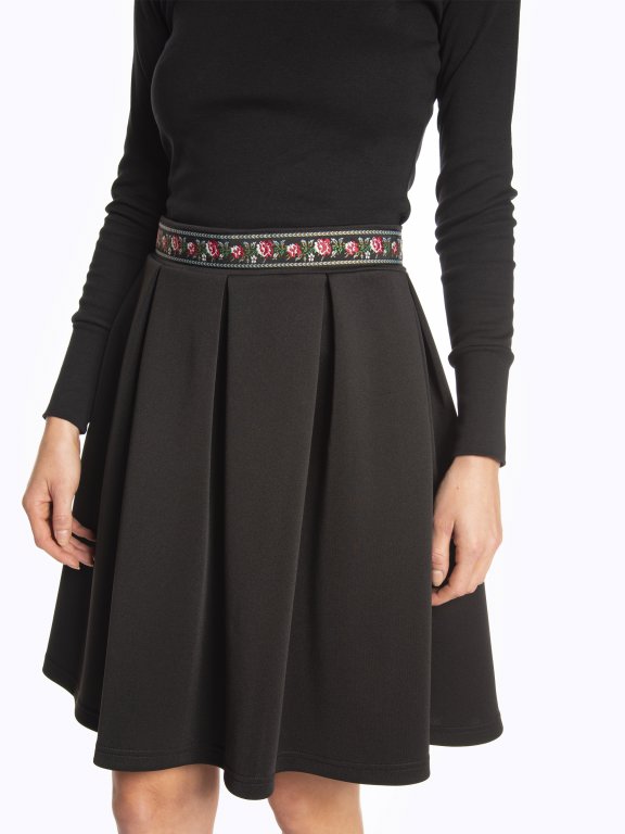 Skater skirt with embroidered waist band