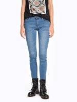 Skinny jeans with zippers on hem