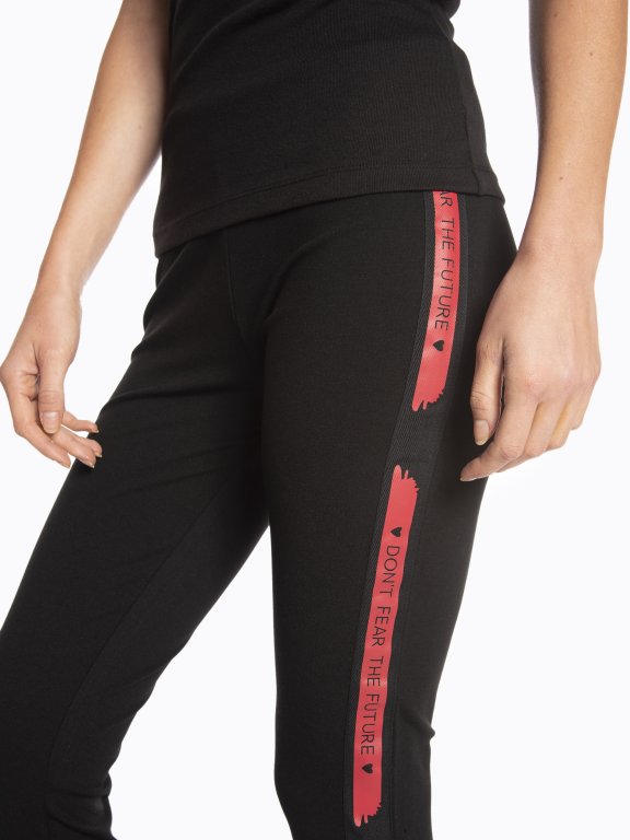 Leggings with message print side tape