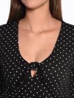Polka dot print top with knot and bell sleeves