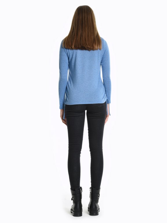 Long sleeved top with side strings