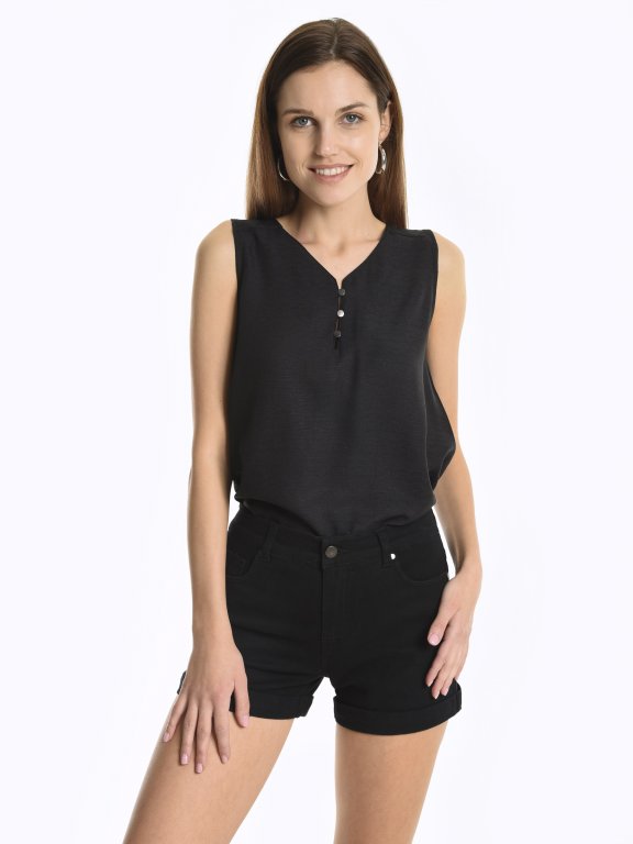 Sleeveless top with buttons