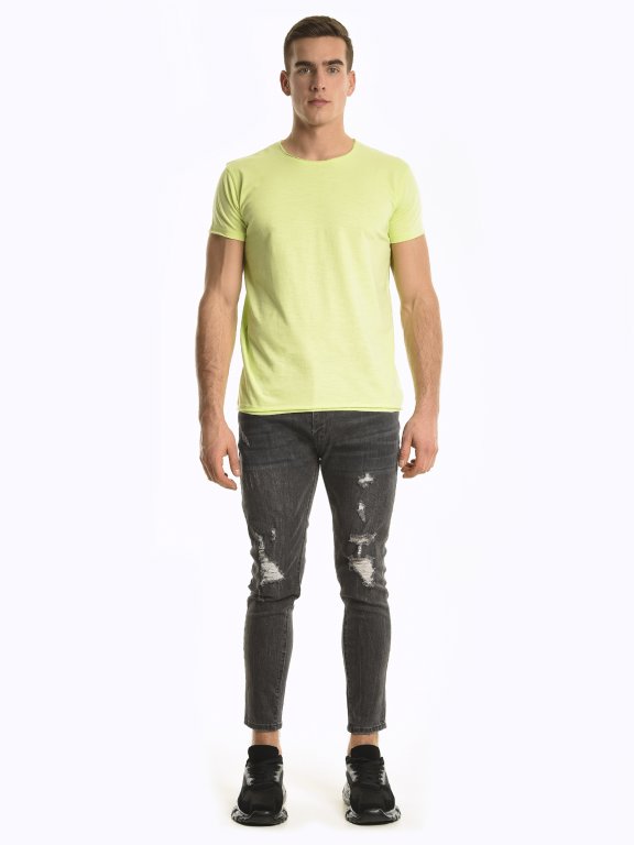 Tapered fit damaged jeans