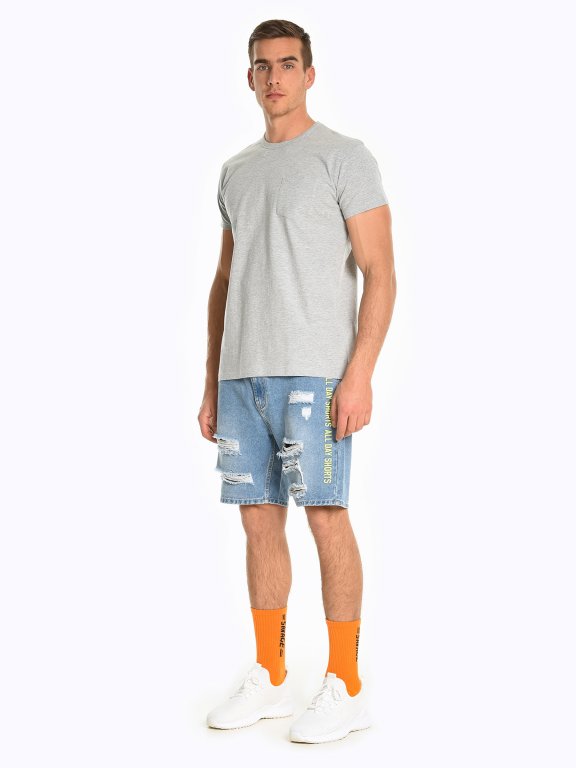 Damaged denim shorts with print