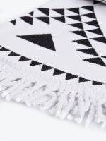 Beach towel with geometric design and tassels