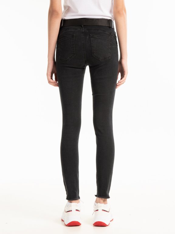 Skinny jeans with metal eyelets