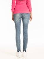 Skinny jeans with patches and raw edges