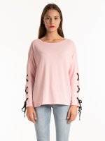 Top with sleeve lacing