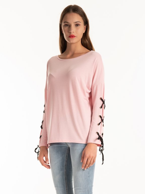 Top with sleeve lacing