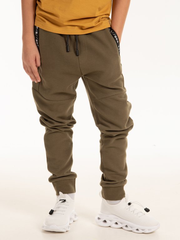 Sweatpants with taped pockets
