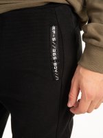 Sweatpants with taped pockets