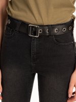 Textile belt with metal eyelets