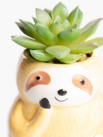Faux flower in sloth flowerpot