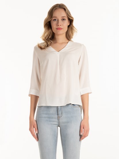 V-neck blouse with roll- up sleeves