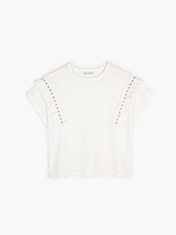 Top with ruffles and studs