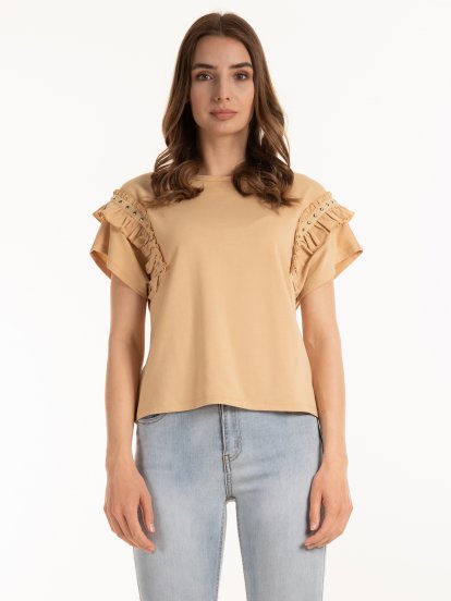 Top with ruffles and studs